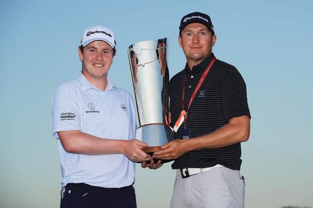 Bob MacIntyre and caddie Mikey Thompson pose with the trophy after the Scot's breakthrough European Tour victory in the Aphrodite Hills Cyprus Showdown. Picture: Andrew Redington/Getty Images