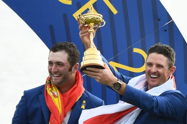 Justin Rose holds the trophy next to Jon Rahm as Europe celebrate winning the 2018 Ryder Cup at Le Golf National in France. Picture: Franck Fife/AFP via Getty Images.