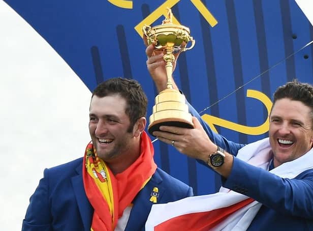 Justin Rose holds the trophy next to Jon Rahm as Europe celebrate winning the 2018 Ryder Cup at Le Golf National in France. Picture: Franck Fife/AFP via Getty Images.