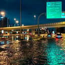 Motorists drive along a flooded street following heavy rains in Dubai.