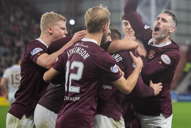 Hearts players celebrate a Lawrence Shankland penalty in the 3-2 win over Motherwell on November 6. (Photo by Mark Scates / SNS Group)