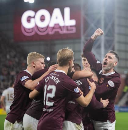 Hearts players celebrate a Lawrence Shankland penalty in the 3-2 win over Motherwell on November 6. (Photo by Mark Scates / SNS Group)