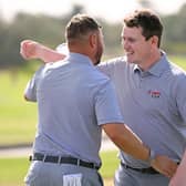 Jordan Smith and Bob Macintyre celebrates after winning their morning foursomes on day two of the Hero Cup at Abu Dhabi Golf Club. Picture: Ross Kinnaird/Getty Images.