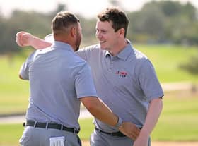 Jordan Smith and Bob Macintyre celebrates after winning their morning foursomes on day two of the Hero Cup at Abu Dhabi Golf Club. Picture: Ross Kinnaird/Getty Images.