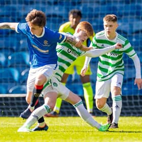 Rangers Alex Lowry tackles Celtic's Ben Summers during a Lowland League match between Rangers B and Celtic B.