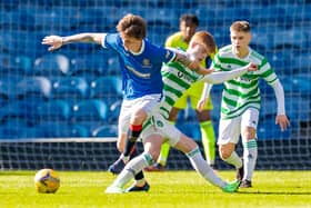 Rangers Alex Lowry tackles Celtic's Ben Summers during a Lowland League match between Rangers B and Celtic B.