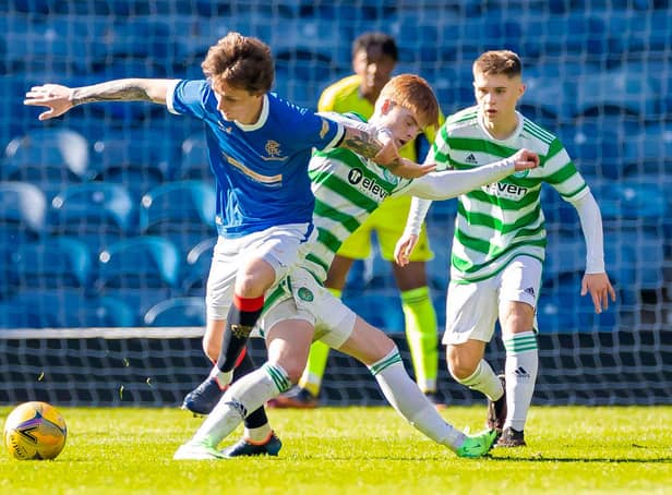 Rangers Alex Lowry tackles Celtic's Ben Summers during a Lowland League match between Rangers B and Celtic B.