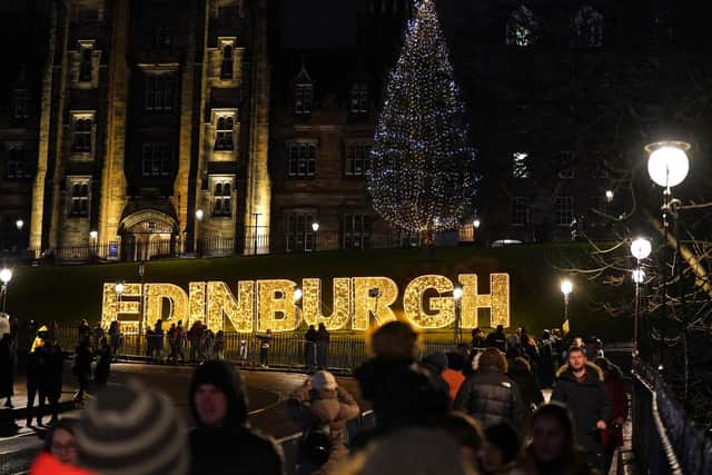 Crowds of revellers gathered on the Mound in Edinburgh on Hogmanay. Picture: Andrew Milligan/PA Wire