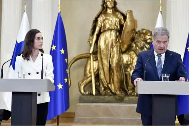 Finland's prime minister, Sanna Marin (left), and its president, Sauli Niinistö, announcing Finland would apply for Nato membership. Photograph: Heikki Saukkomaa/Lehtikuva/AFP/Getty Images