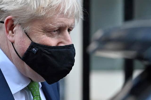 Prime Minister Boris Johnson, wearing a face covering to help mitigate the spread of coronavirus, leaves from 10 Downing Street in central London. Picture: Justin Tallis/AFP via Getty Images