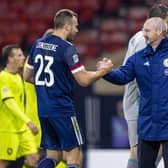 Andy Considine is congratulated by Steve Clarke on another fine performance for his country