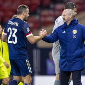 Andy Considine is congratulated by Steve Clarke on another fine performance for his country