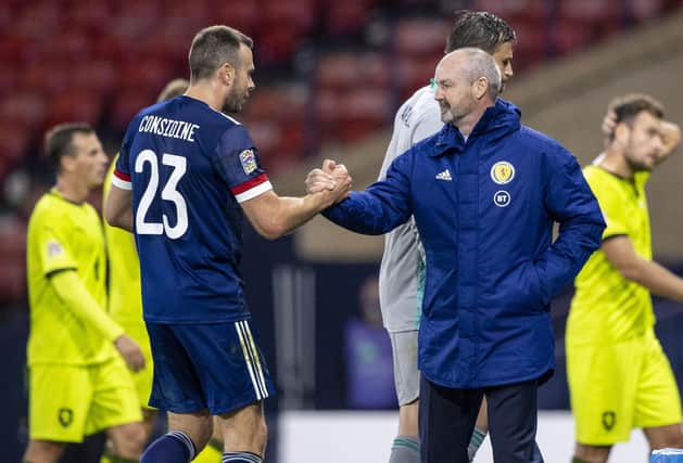 Andy Considine is congratulated by Steve Clarke on another fine performance for his country