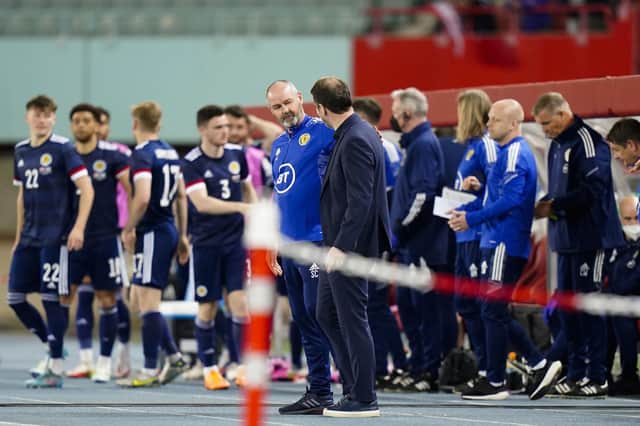 Scotland's manager Steve Clarke talks with Austria's head coach Franco Foda before the match in Vienna.