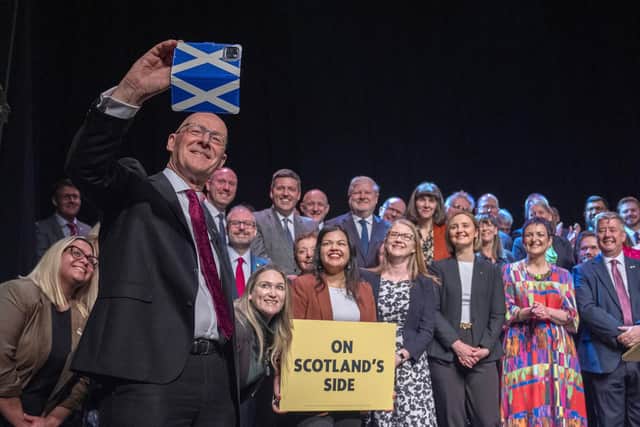 John Swinney takes a selfie with candidates for the 2026 Holyrood election (Picture: Jane Barlow/PA Wire)