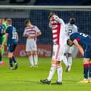 Jamie Hamilton buries his head in his shirt after the full-time whistle sounded in Dingwall. Picture: SNS
