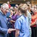 King Charles III meets staff and patients as he visits NHS Lothian's Medicine of the Elderly Meaningful Activity Centre at the Royal Infirmary of Edinburgh, to celebrate 75 years of the NHS. Picture: Jane Barlow - WPA Pool/Getty Images