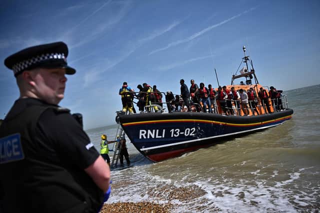 The Human Rights Act helped prevent people crossing the English Channel in small boats from being sent to Rwanda (Picture: Ben Stansall/AFP via Getty Images)