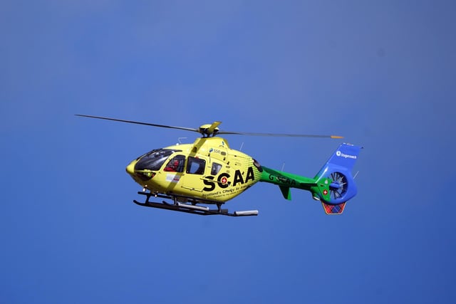 Scotland's Charity Air Ambulance leaves Imperial Dock in Leith, Edinburgh, where a ship has become dislodged from its holding and is partially toppled over. Picture date: Wednesday March 22, 2023.