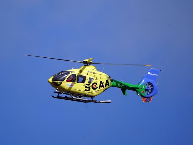 Scotland's Charity Air Ambulance leaves Imperial Dock in Leith, Edinburgh, where a ship has become dislodged from its holding and is partially toppled over. Picture date: Wednesday March 22, 2023.