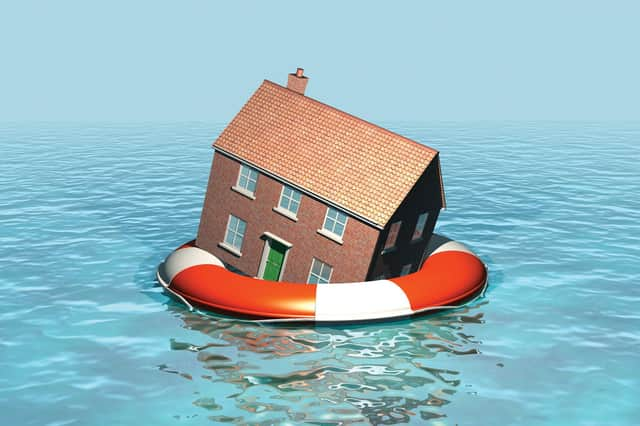 House on a lifebelt, housing market in trouble, rising sea levels