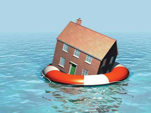 House on a lifebelt, housing market in trouble, rising sea levels