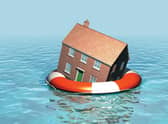 House on a lifebelt, housing market in trouble, rising sea levels