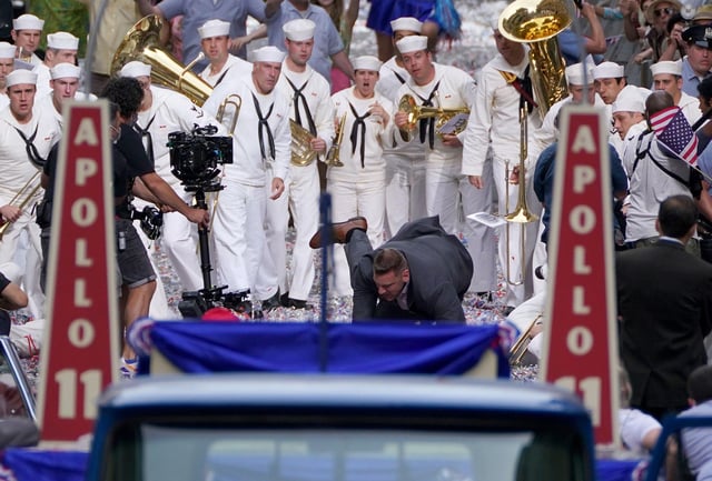 A cast member falls to the ground and requires medical attention during a scene.