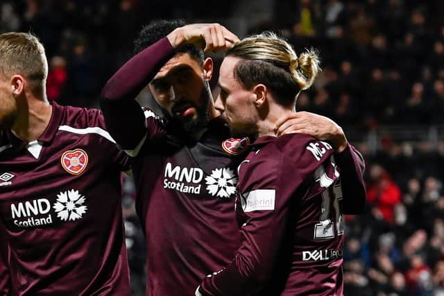 Hearts' Josh Ginnelly points to Barrie McKay after making it 2-0 againt St Johnstone. (Photo by Rob Casey / SNS Group)