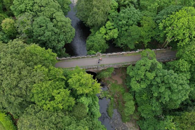 Cyclists on the disused four-arch railway viaduct over the River Doon in Alloway. Picture: Markus Stitz