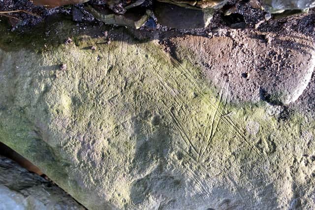 The large decorated stone found on the beach, which is similar to those found at Skara Brae. PIC. UHI Archaeology Institute.