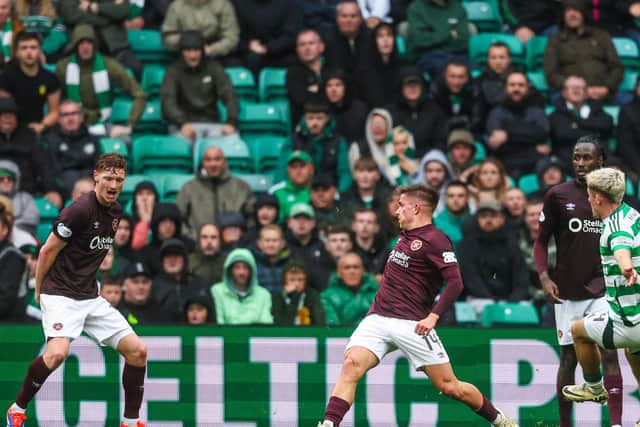 Luke McCowan slots home his first goal for Celtic to secure all three points against Hearts (Photo by Ross MacDonald / SNS Group)