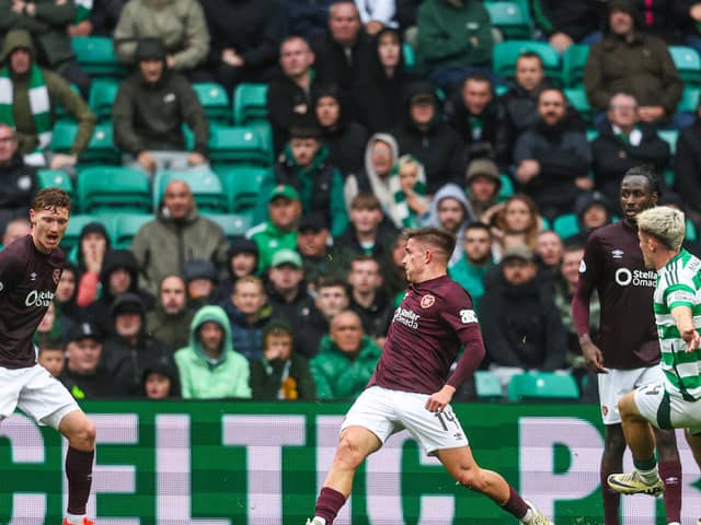 Luke McCowan slots home his first goal for Celtic to secure all three points against Hearts (Photo by Ross MacDonald / SNS Group)