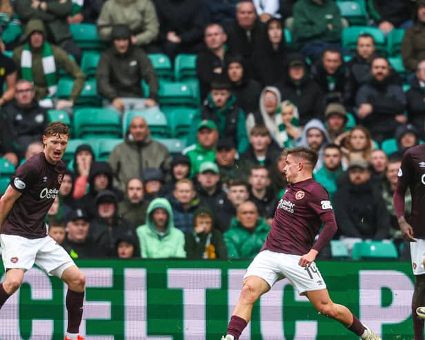 Luke McCowan slots home his first goal for Celtic to secure all three points against Hearts (Photo by Ross MacDonald / SNS Group)