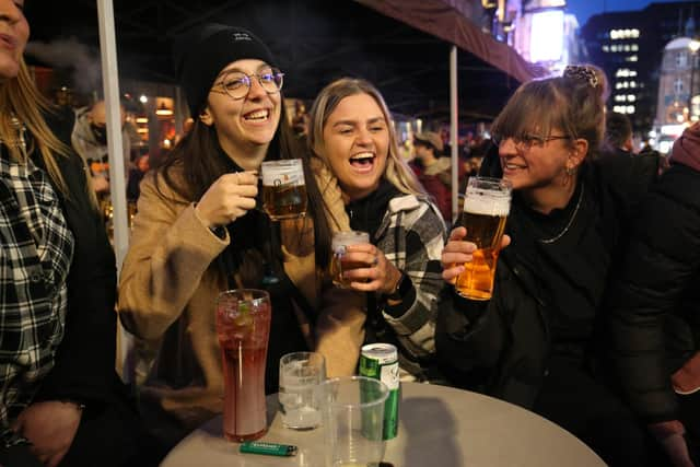 People drinking in Old Compton Street in Soho, central London, where streets have been closed to traffic to create outdoor seating areas for the reopening bars and restaurants as England takes another step back towards normality with the further easing of lockdown restrictions. Picture date: Monday April 12, 2021.