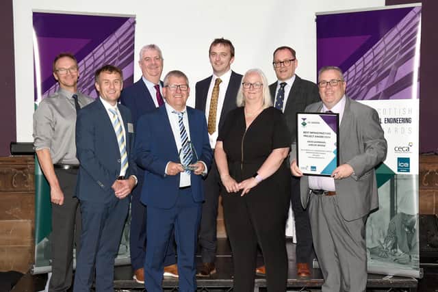 Representatives of Aberdeenshire Council and Wills Bros Civil Engineering Ltd celebrate their award success for the Gairnshiel Jubilee Bridge project on Royal Deeside.