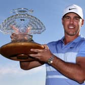 Brooks Koepka poses with the trophy after winning the the Waste Management Phoenix Open at TPC Scottsdale. Picture: Christian Petersen/Getty Images.