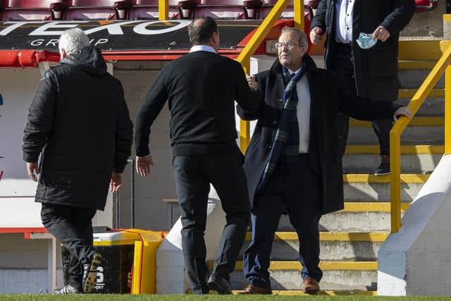 Ross County chairman Roy MacGregor celebrates with his manager Malky Mackay.