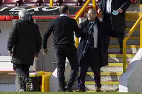 Ross County chairman Roy MacGregor celebrates with his manager Malky Mackay.