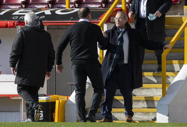 Ross County chairman Roy MacGregor celebrates with his manager Malky Mackay.