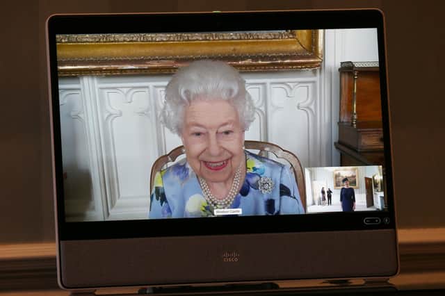 The Queen appears on a screen by videolink from Windsor Castle during a virtual audience to receive Her Excellency Ivita Burmistre, the Ambassador of Latvia, at Buckingham Palace, London.