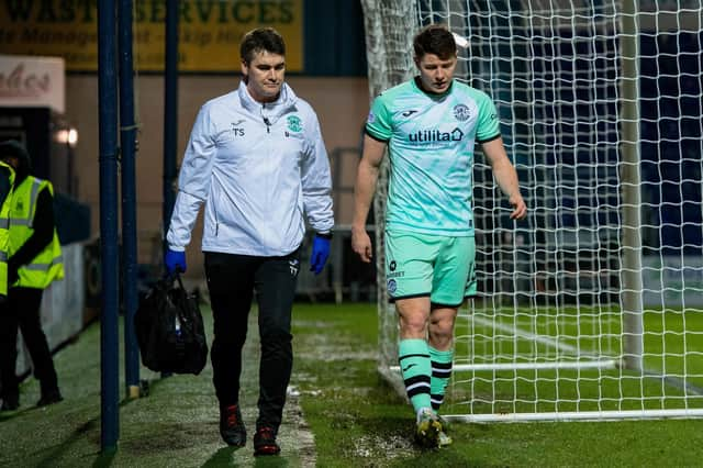 Hibs' Kevin Nisbet went off with a hamstring injury during the 1-1 draw at Ross County.