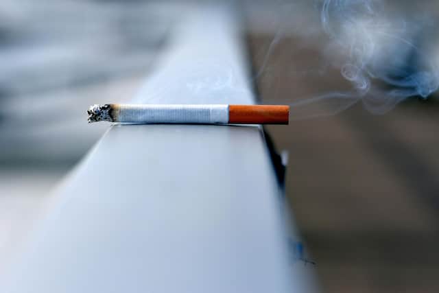 Image of a cigarette left on a surface.