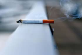 Image of a cigarette left on a surface.