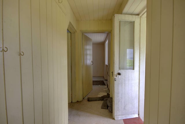The stone-built cottage has two bedrooms on the upper floor with the walls finished in traditional wood panelling. Two open fires heat the ground floor.