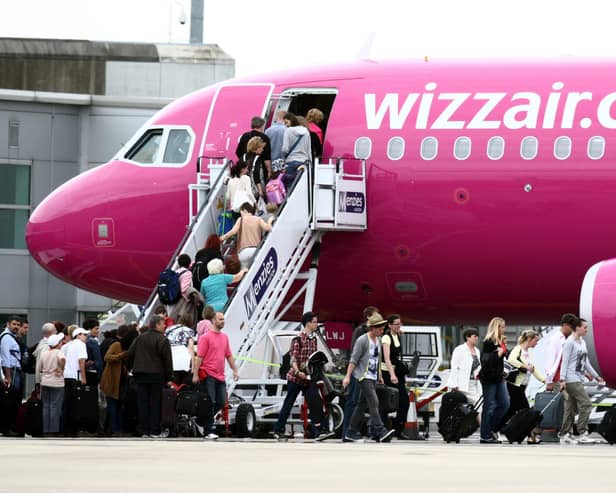 Passengers getting on a Wizz Air plane at Luton Airport. Picture: Steve Parsons/PA Wire