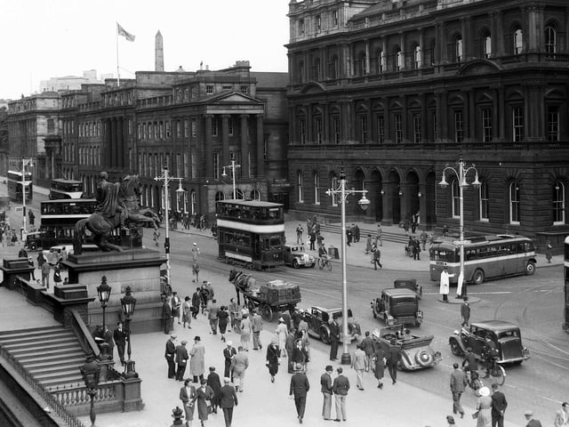 Waterloo Place and the GPO building from Register House at the East End of Princes Street shows how people of Edinburgh used all methods of transport - trams, buses, cars, horse and cart and bicycles in 1943.