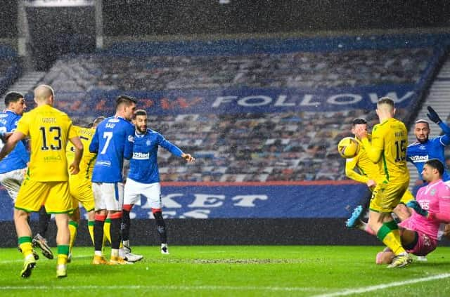 Hibs goalkeeer Dillon Barnes makes a fine save to deny Leon Balogun in the second half of Rangers' 1-0 win at Ibrox. Photo by Rob Casey / SNS Group)