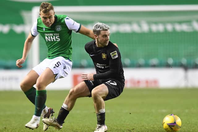 Livingston's Scott Robinson gets the better of Hibs defender Ryan Porteous during the West Lothian side's 3-0 victory. Photo by Ross MacDonald / SNS Group