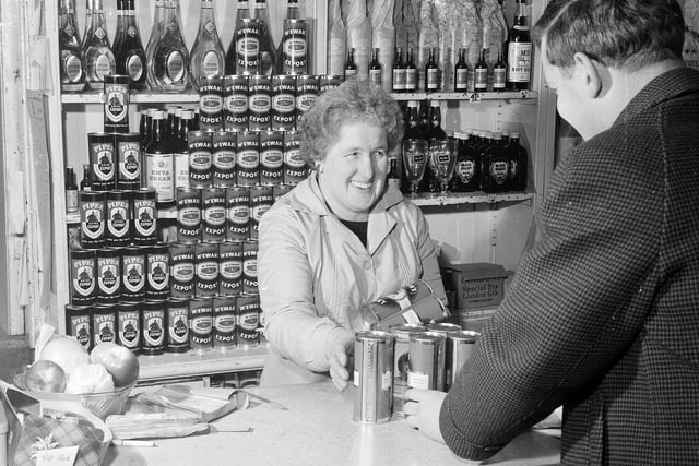 A customer stocks up for Hogmanay at Edinburgh's HJ Hildersley licensed grocers.